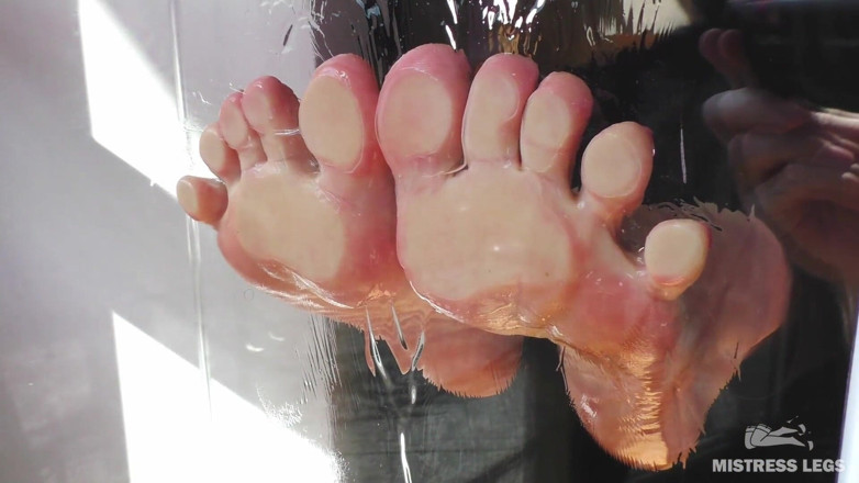 Mistress Legs: Mistress barefoot soles rubbing against the glass and squeezing strawberries