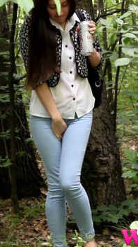 Desperate Brunette in a Forest Holding Her Crotch to Stop Herself From Pissing in Her Jeans