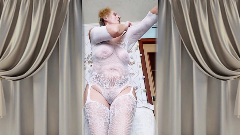 Lukerya: Hot Housewife Lukerya Flirts in an Open Transparent White Jumpsuit...