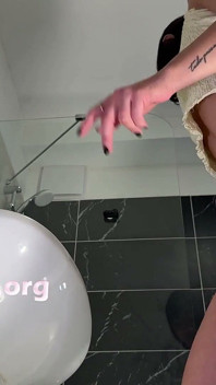 Amazingly Beautiful Hot Brunette Babe in the Bathroom Takes Her Thong off Under White Mini Tennis Skirt to Flash Shaved Pussy