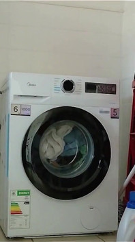 Laundry in Highheels Doing Laundry in Denim Shorts and Pointy Stilettos
