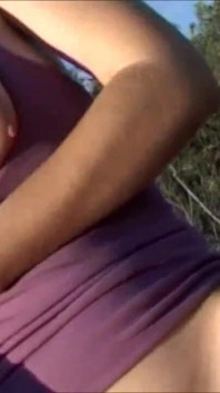 Horny brunette with big boobs masturbating outdoor
