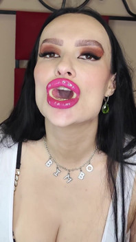 Big-lipped Bimbo Inflates a Condom and Plays with It.