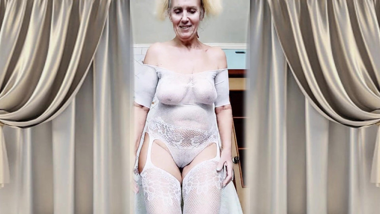 Lukerya: Hot Housewife Lukerya Flirts in an Open Transparent White Jumpsuit...