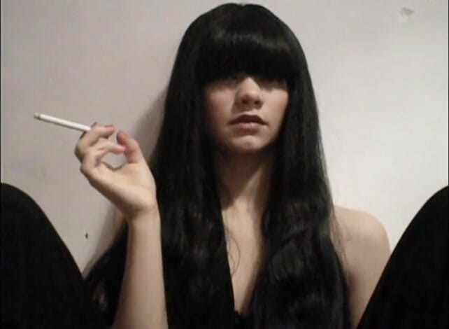 Femdom Austria: Long haired bitch smoking a cigarette