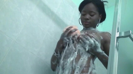 Solo Sensations: Leggy black chick with big breasts gets wet and soapy...