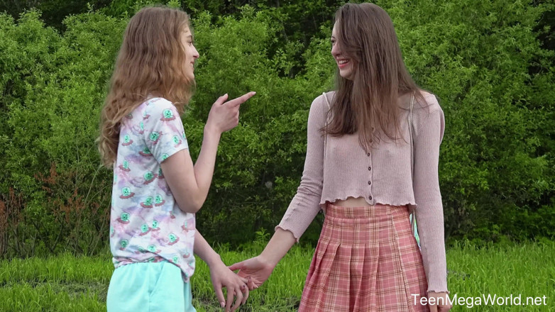 Teen Mega World: Hot Chicks Lick Clits in Field