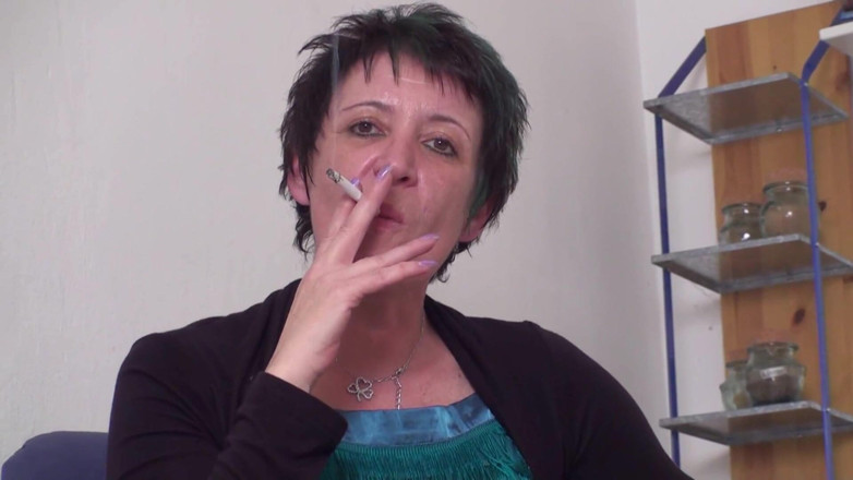 Femdom Austria: Brunette mature slut smoking a cigarette