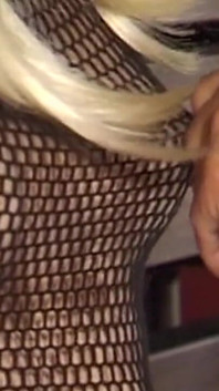 Mature Dominatrix Oversees Masked Man with Bound Blonde