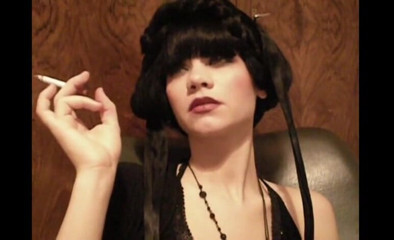 Femdom Austria: Glamorous beauty smoking a cigarette