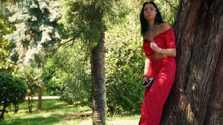 Russian Smokers: Seductive Russian Beauty Smoking Slim Cigarette Outdoors