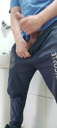 A Well-endowed Brazilian Man Urinating and Showing His Thick Penis to His Female Friends.