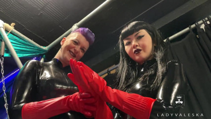 Lady Valeska: Latex Dommes invite you to suck their huge strap ons