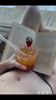 Reading by the Pool in a Bikini That Barely Counts as Spf