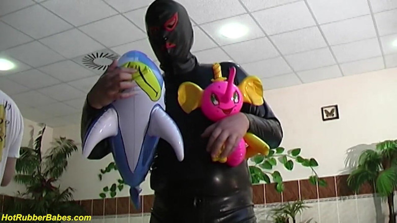 Fetish Islands: Sexy flexi latex teen playing with her rubber doll