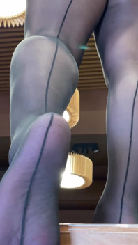 Goddess with Long Legs and Big Ass in Black Pantyhose on the Table Plays with a Toe Ring Above Your Face