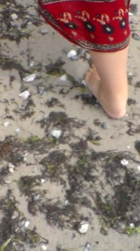 Jen Shows up Her Naked Feet in the Sand
