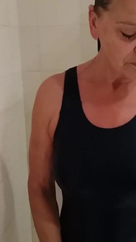 Grandma in a Tight Swimsuit Taking a Shower!