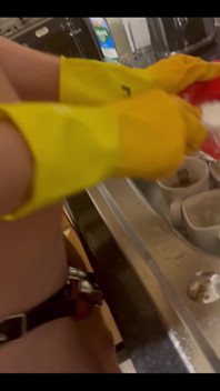 My Chastity Sub Washing the Pots for Me Naked in His Chastity Cage and with His Marigolds on