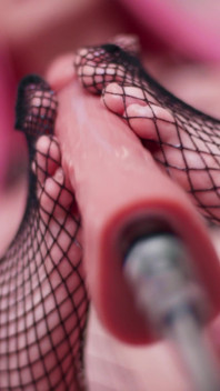 Cutie in Fishnets Doing a Footjob with Fuckmachine