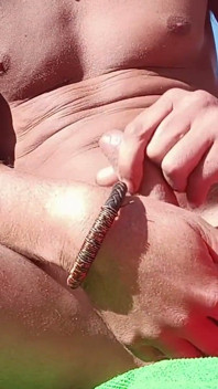 A Sexy Guy on the Beach Masturbates and Swallows His Semen.