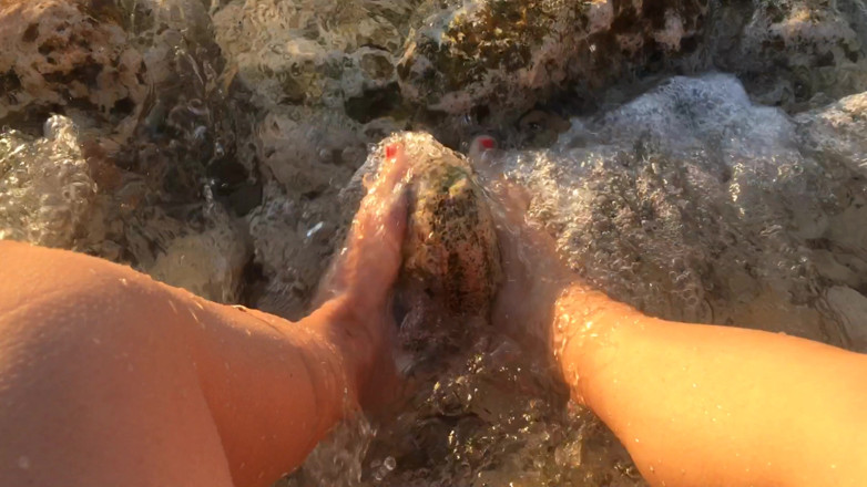 Risky Hairy Couple: My Feet in the Sea Over the Stones