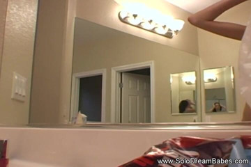 Solo Dream Babes: Cute brunette putting make up in the bathroom