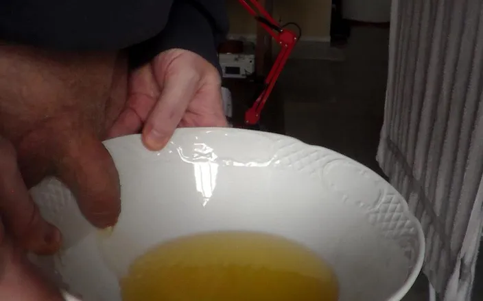 Sex hub male: John is pissing in a bowl in closeup