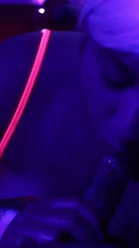 Rave Slut Sucks on a Juicy Cock