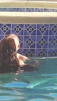 Hot Long Haired Ginger MILF Taking a Dip and Fucking in Outdoor Pool