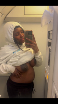 Showing my bare titties and pregnant belly