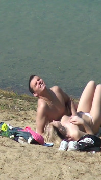 A couple of young nudists are spied on while having sex and enjoying themselves on the beach