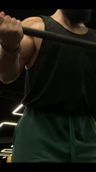 Doing a Biceps Curls with a Straight Barbell