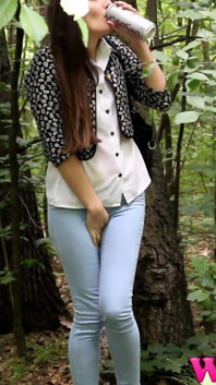 Desperate Brunette in a Forest Holding Her Crotch to Stop Herself From Pissing in Her Jeans
