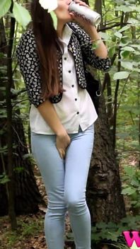 Desperate Brunette in a Forest Holding Her Crotch to Stop Herself From Pissing in Her Jeans