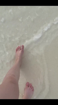 Running my bare feet on the white beach sand by the ocean.