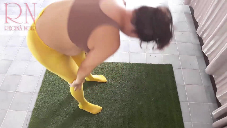 Regina Noir: Regina Noir. Yoga in yellow tights doing yoga in the...
