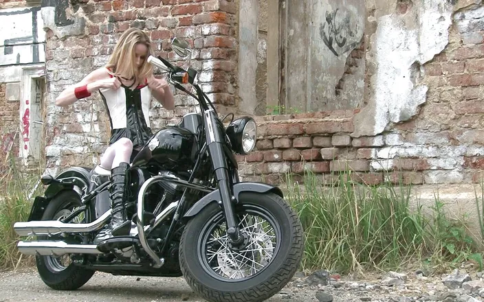 Public Entertainment: Skinny blonde on a bike