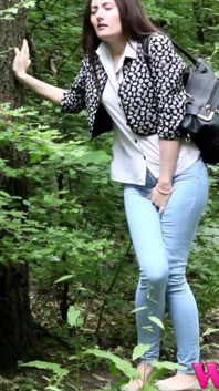 Desperate Brunette in a Forest Holding Her Crotch to Stop Herself From Pissing in Her Jeans