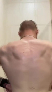 Alpha Shows off His Back Muscles