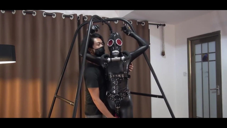 OrangeXXOO: The Joy of Latex Clothing and Gas Masks