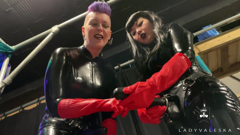 Lady Valeska: Latex Dommes invite you to suck their huge strap ons