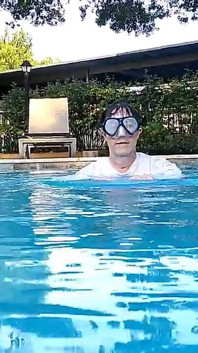 Couple Underwater Diving and Swimming