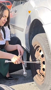 Dirndl Slut Gets Dirty and Oily Changing Tires