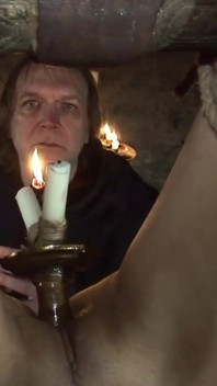 Witch Hangs Upside Down and Gets Drizzled with Black Wax