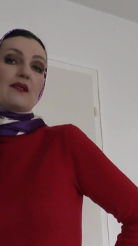 Lady Victoria Valente Showed Elegant Satin Headscarves with a Red Cashmere Turtleneck Sweater