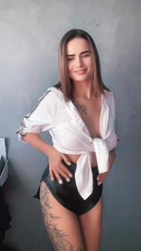 A Brunette in a White Shirt Is Ready to Bare Her Big Breasts