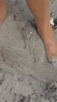 Jen Shows up Her Naked Feet in the Sand