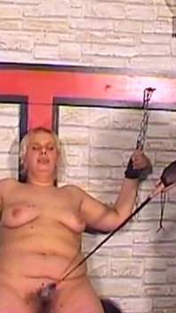 Mature Mistress Covers Her Bound Slave in Hot Wax