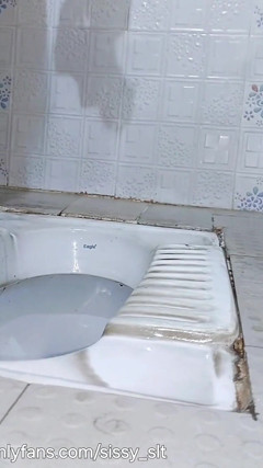 Ladyboy Strip and Piss Outdoor in Chastity Cage and Plug